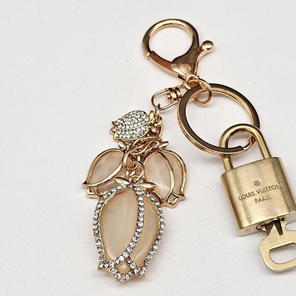 Authentic Louis Vuitton Lock & Key with unbranded Tulip  Authentic Louis Vuitton Lock & Key with unbranded Tulip Bagcharm, Keycharm